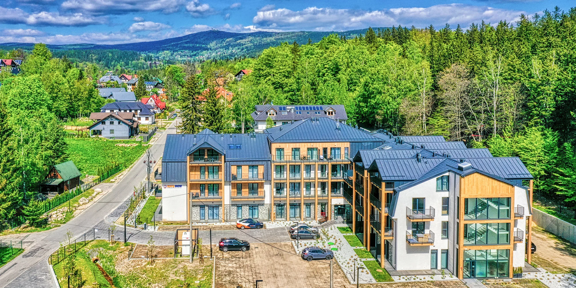 Relax a aktívna dovolenka v poľských Krkonošiach: moderné apartmány, neobmedzená sauna